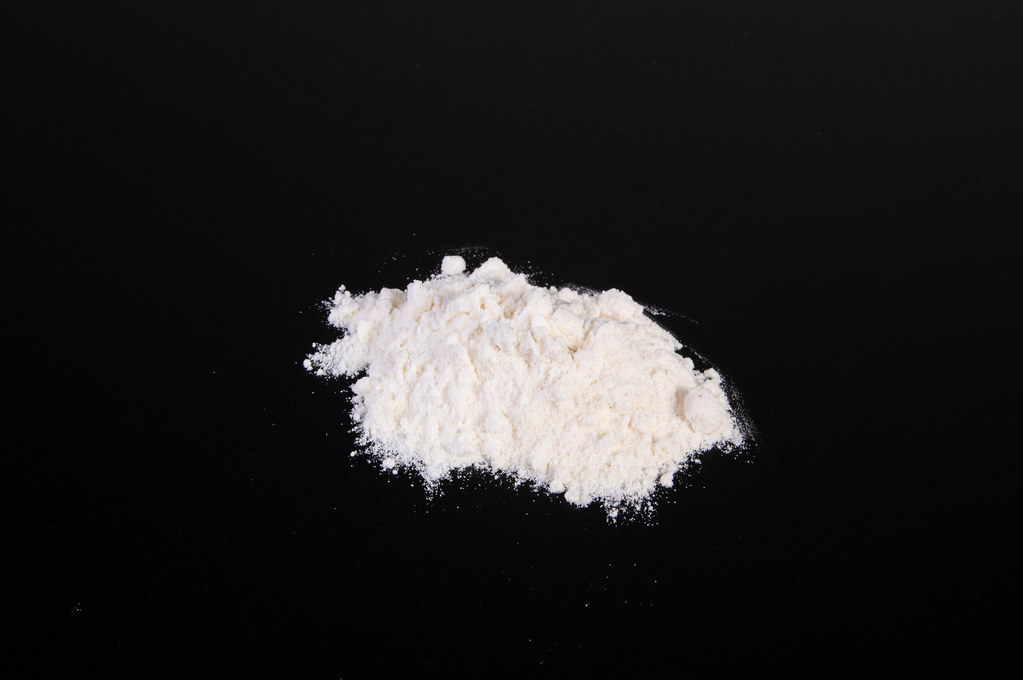 Cocaine powder on black table