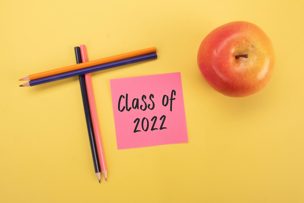 Colored pencils and apple with Class of 2022 text