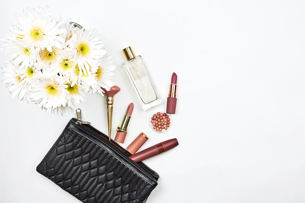 Colorful composition with female beauty accessories and spring flowers