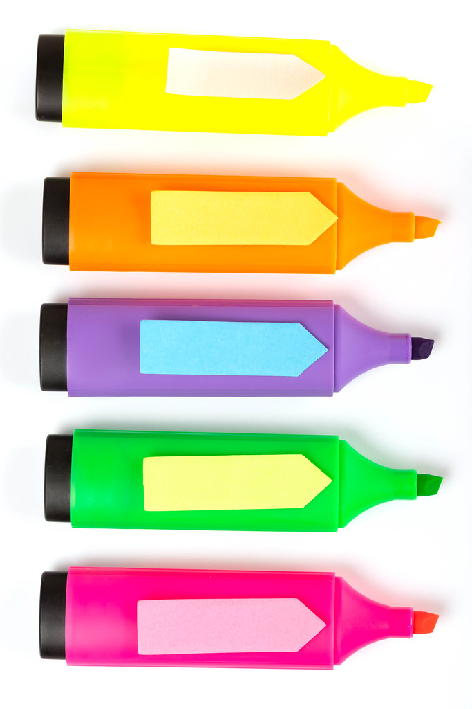Colorful post-it notes in the form of arrows on markers