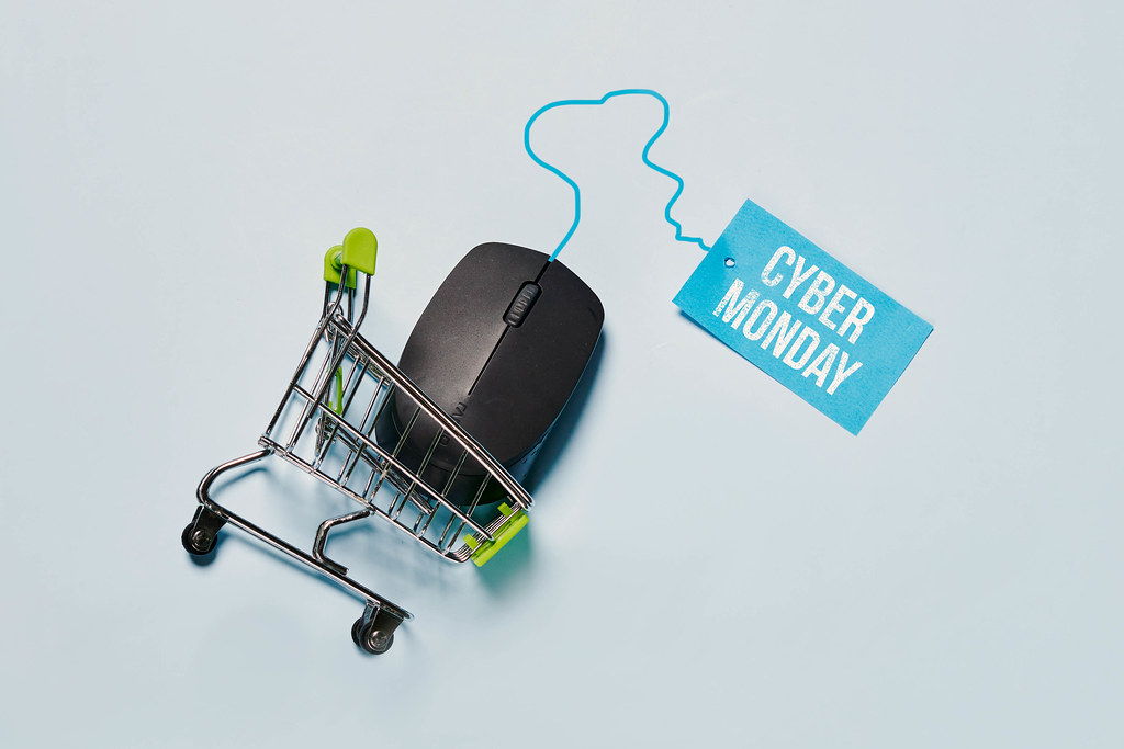 Computer mouse in the shopping cart. Cyber Monday concept