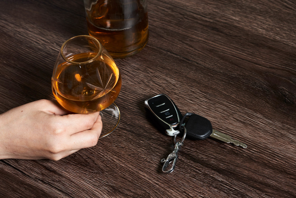 Concept of driving a car after alcohol consumption
