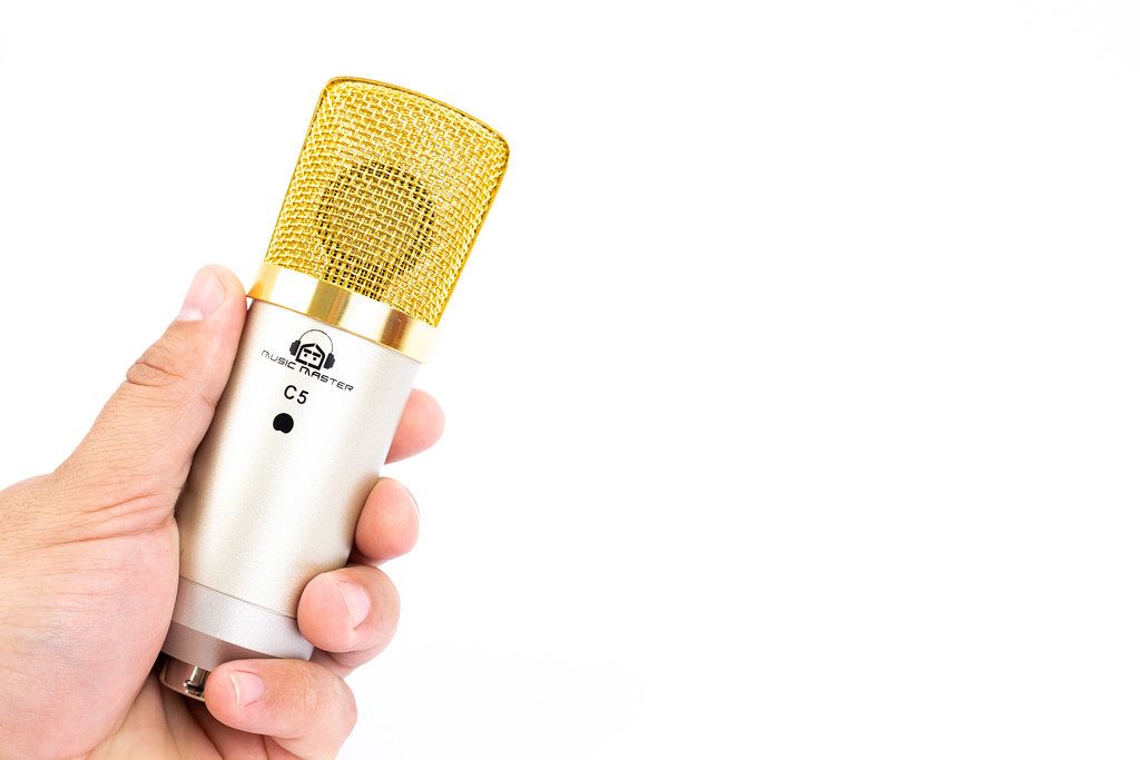 Condenser Studio Microphone in the hand with copy space