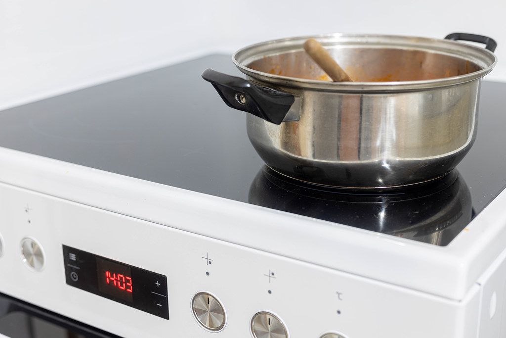 Cooking Bowl on the modern cooking stove at the home