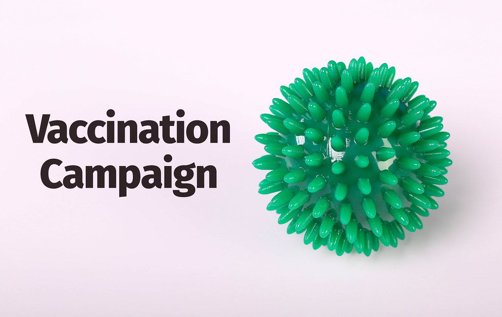 Coronavirus Bacteria concept with Vaccination Campaign text