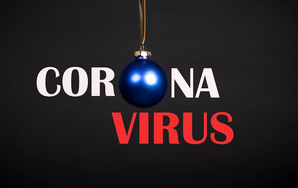 Coronavirus text with Christmas ornament