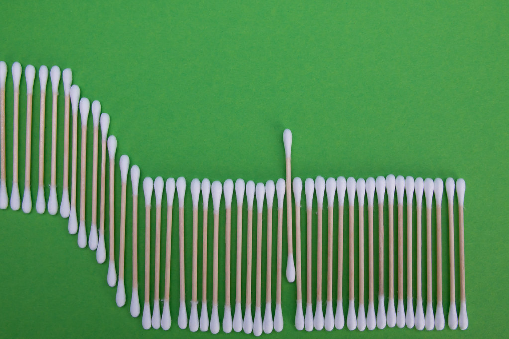 Cotton swabs on a green background
