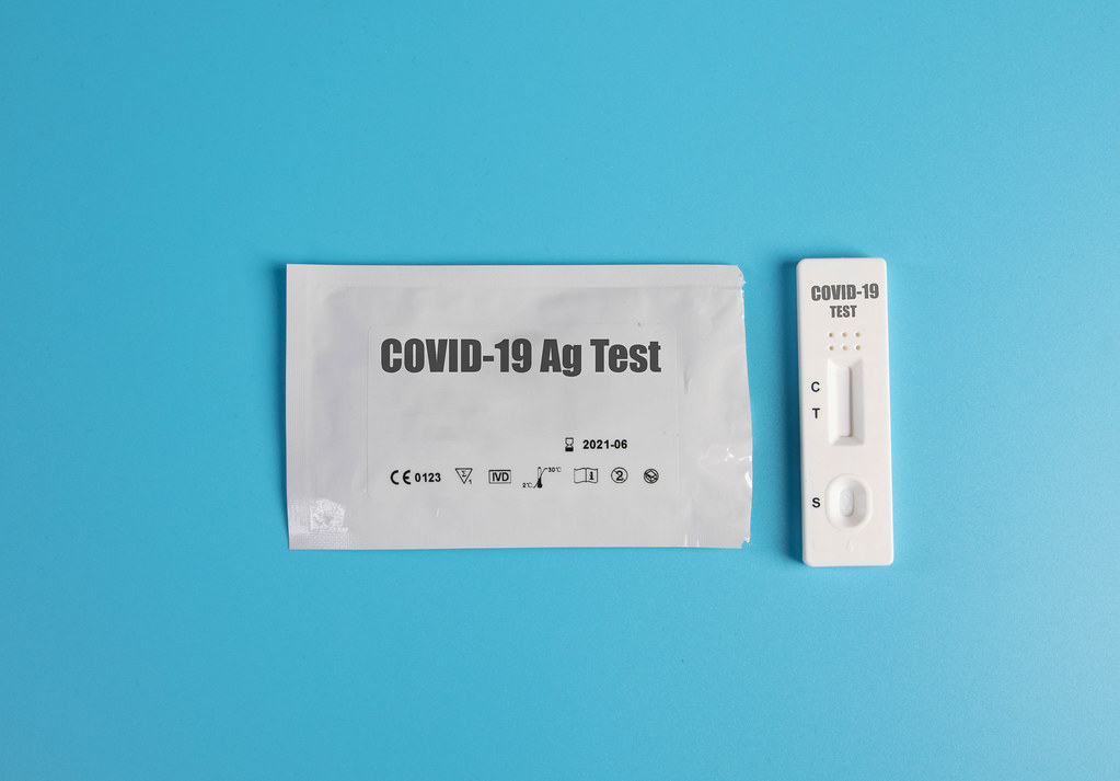 Covid-19 rapid antigen test kit on blue background