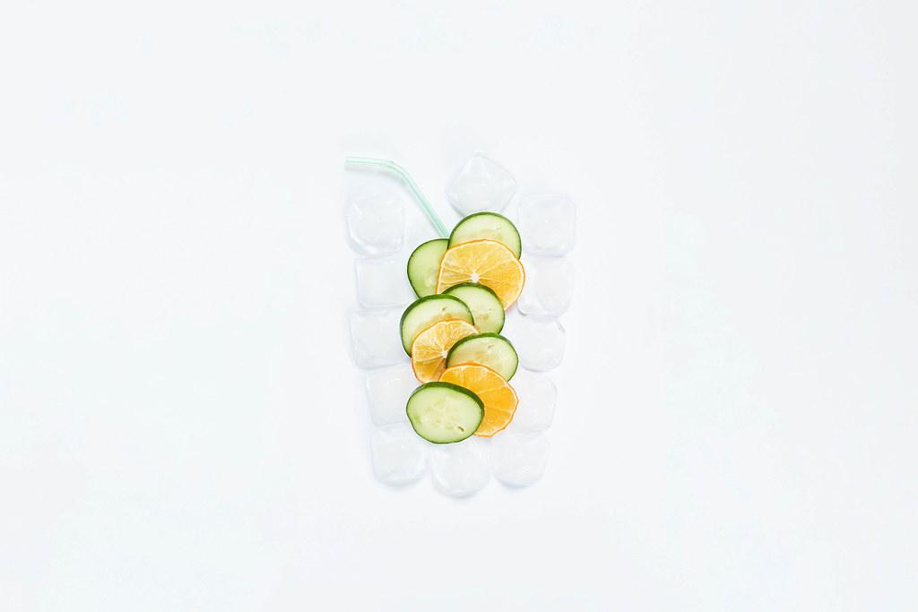 Creative concept of refreshing summer cocktail on white background