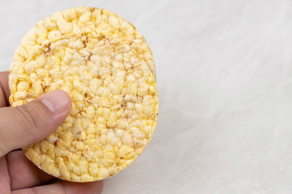 Crunchy Corn snacks in the hand with copy space