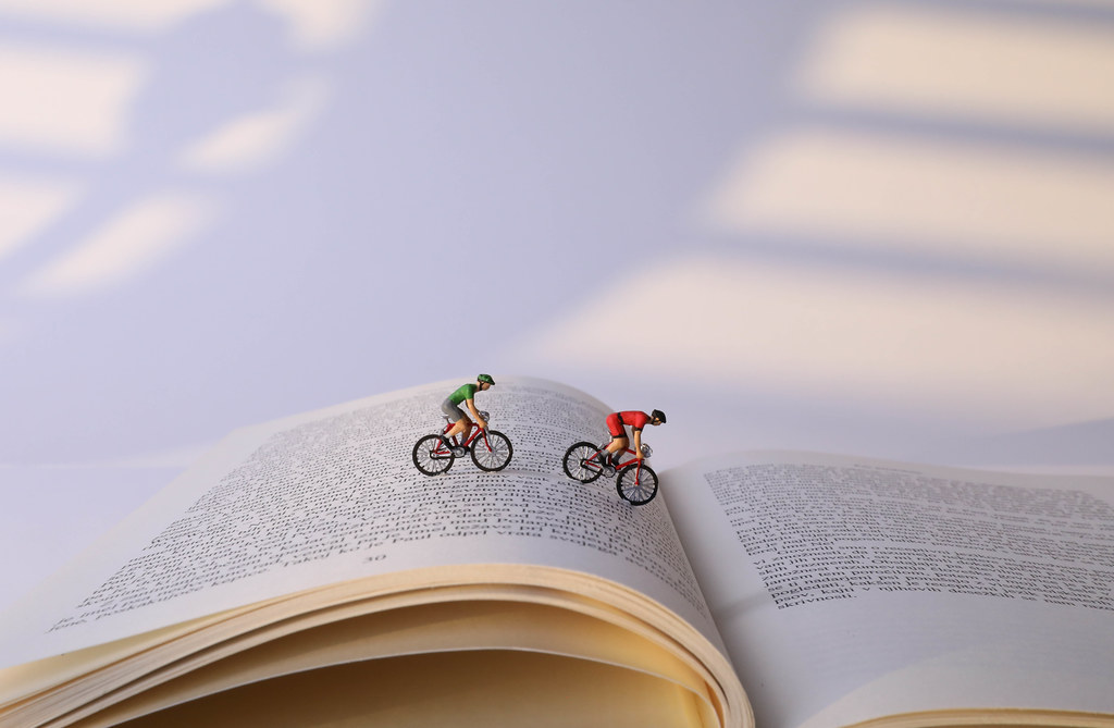 Cyclists on a book