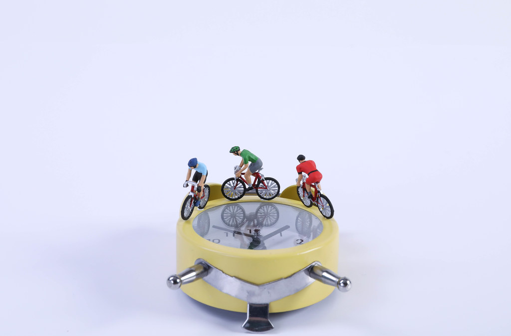 Cyclists on a yellow alarm clock