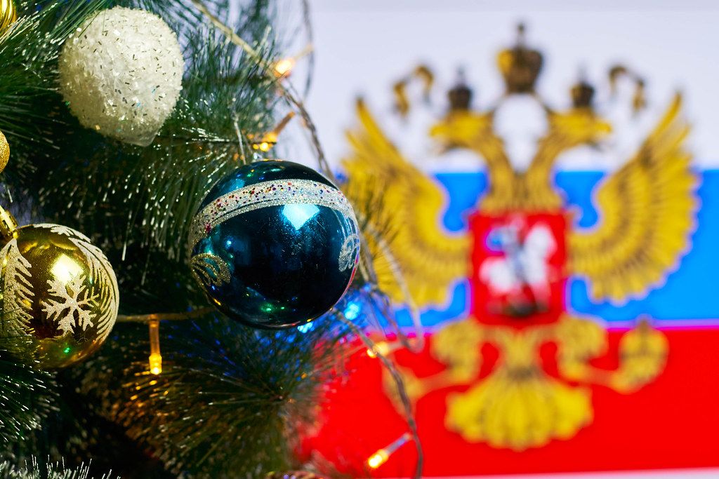 Decorated Christmas tree against the Russia flag