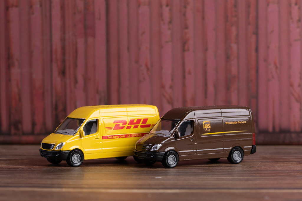 DHL and UPS sign Delivery Trucks