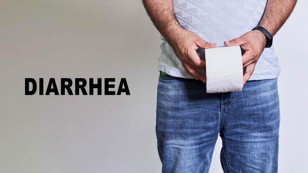 Diarrhea concept - Man holds a toilet paper