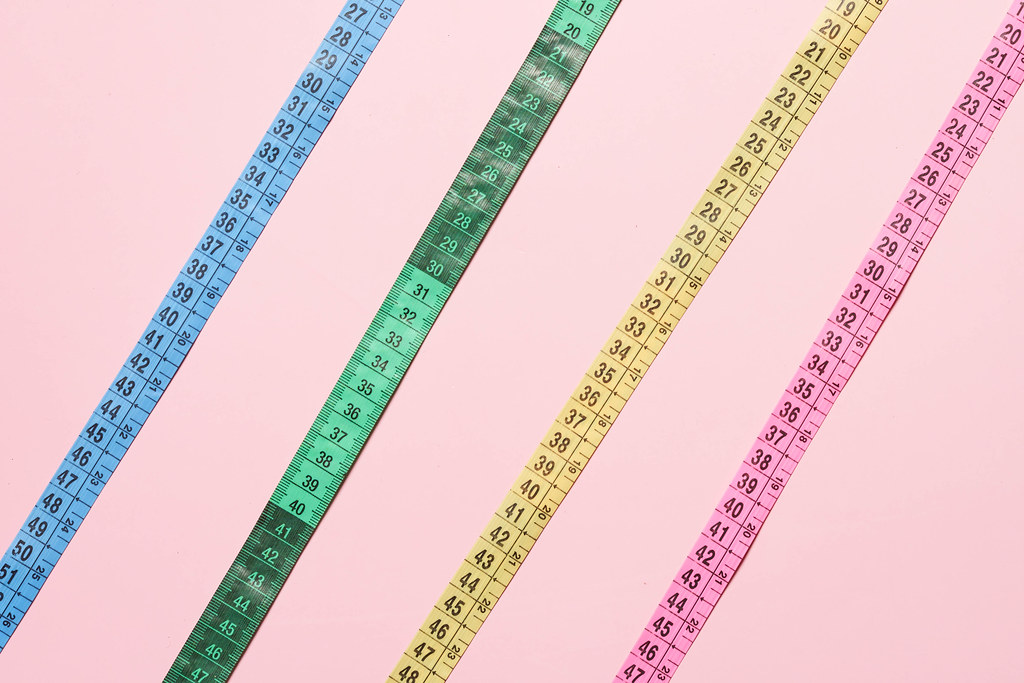 Different colorful plastic measuring tapes