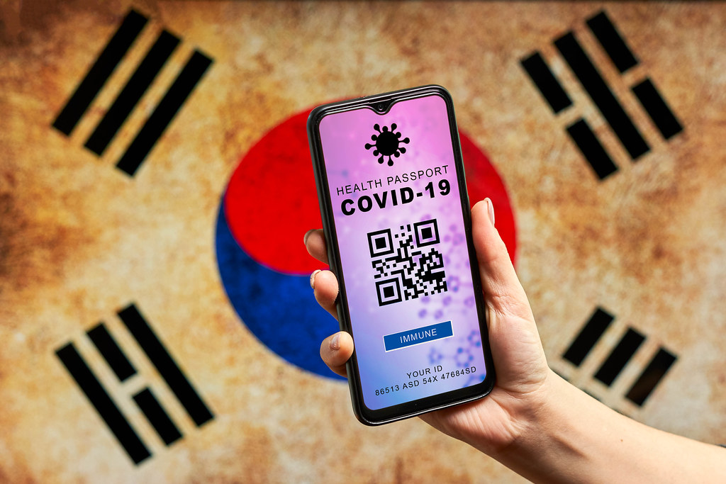 Digital Corona passport against South Korean flag