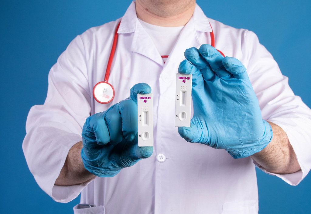 Doctor holding Coronavirus rapid diagnostic test kit