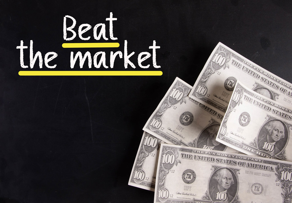 Dollar banknotes with Beat the market text