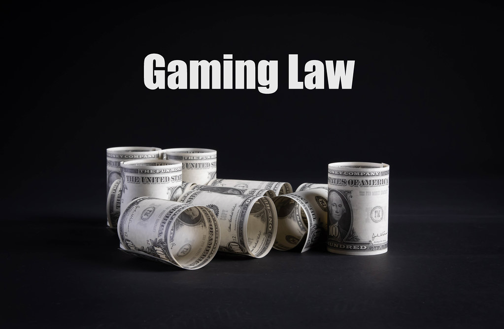 Dollar money banknotes rolls with Gaming Law text