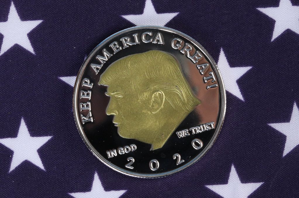 Donald Trump on a coin with American flag