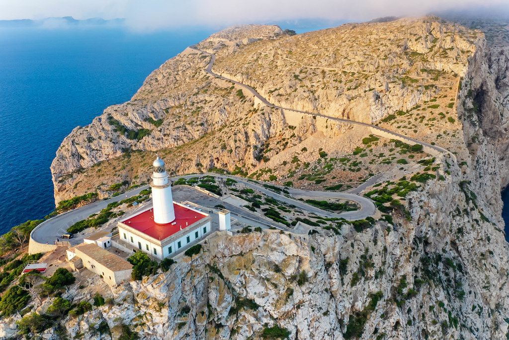Drone shot of Majorca's spectacular landscape: the rocky Formentor headland with its lighthouse