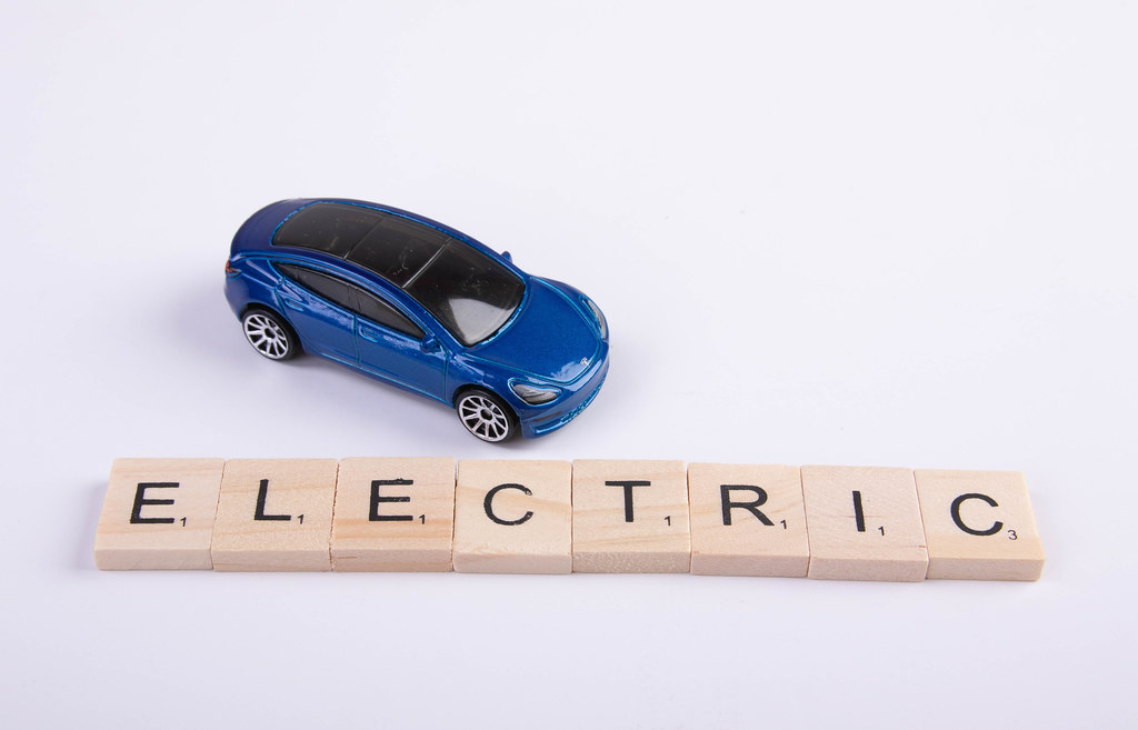 Electric toy car with Electric text on wooden blocks