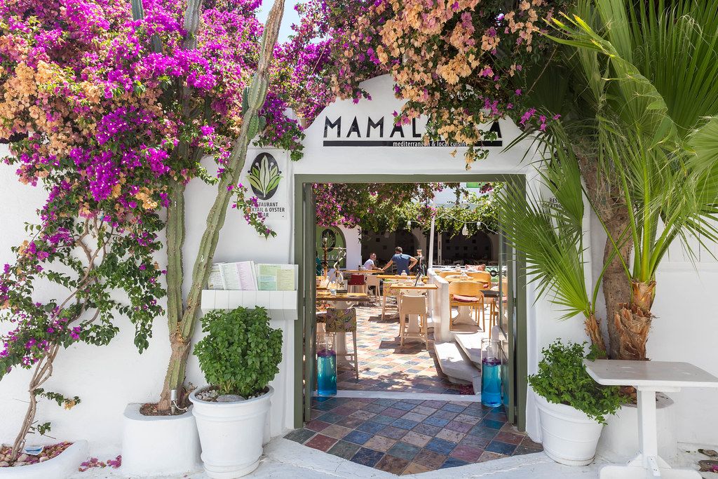 Entrance of the Mamalouka restaurant with local cuisine and open-air terrace in Mykonos