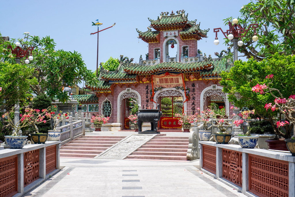 Entrance Stone Gate of the Assembly Hall of Fujian Chinese and Phuc Kien Pagoda with many Ornaments, Lanterns and Statues in the Old Town of Hoi An, Vietnam