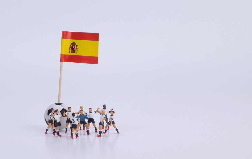 Flag of Spain and group of football players