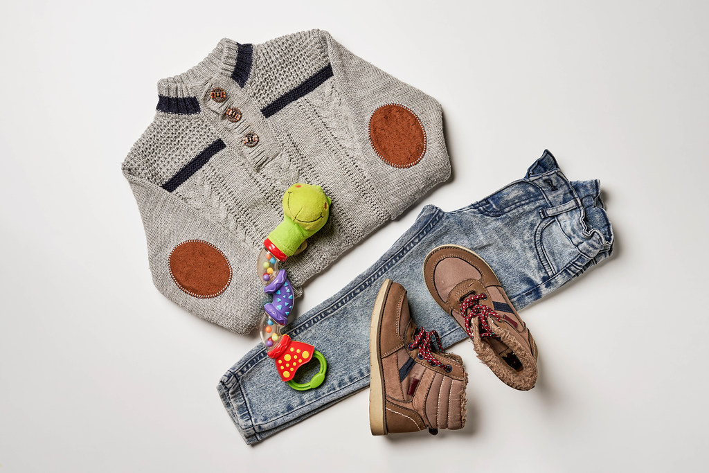 Flat lay composition with stylish child clothes and shoes