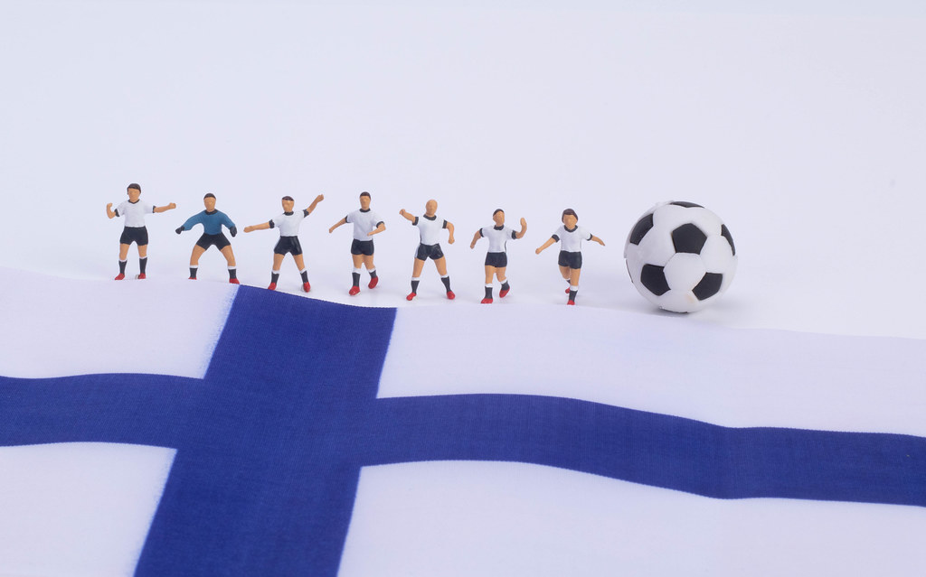 Football players and flag of Finland