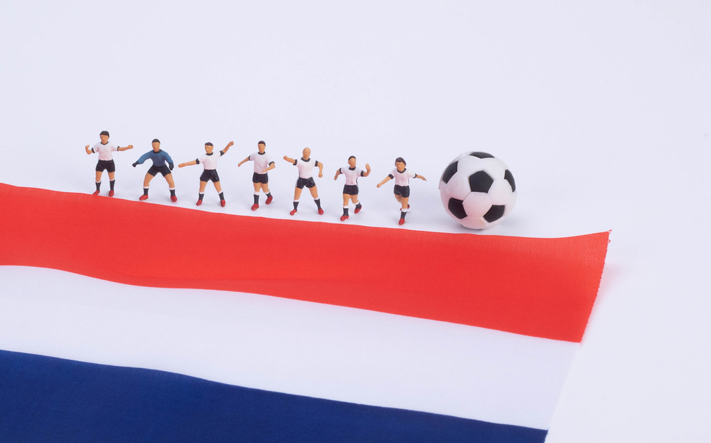 Football players and flag of Netherlands