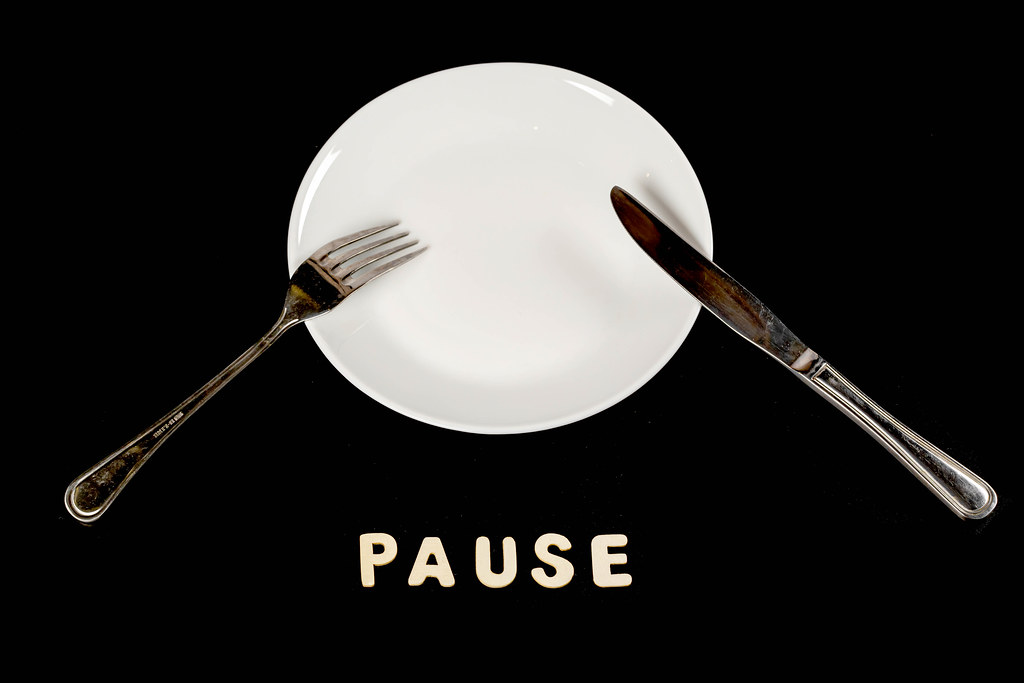 Fork, knife and empty plate, dining etiquette concept, pause meal