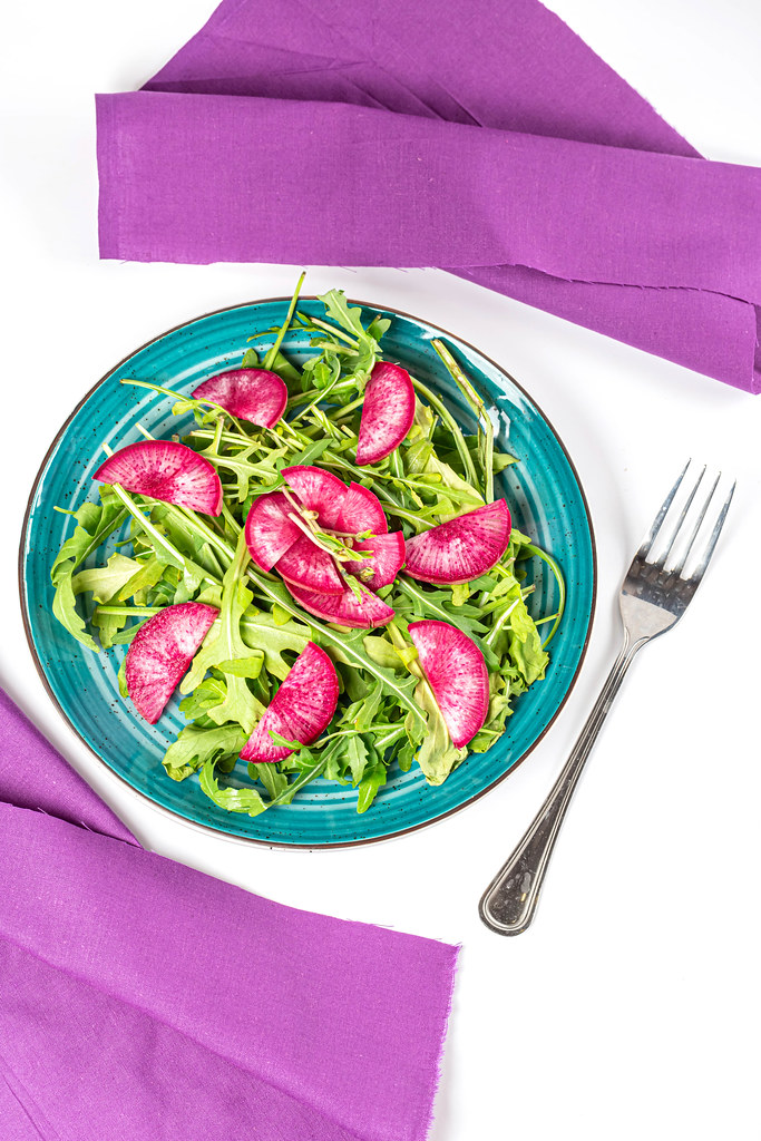 Fresh healthy salad with arugula and red radish