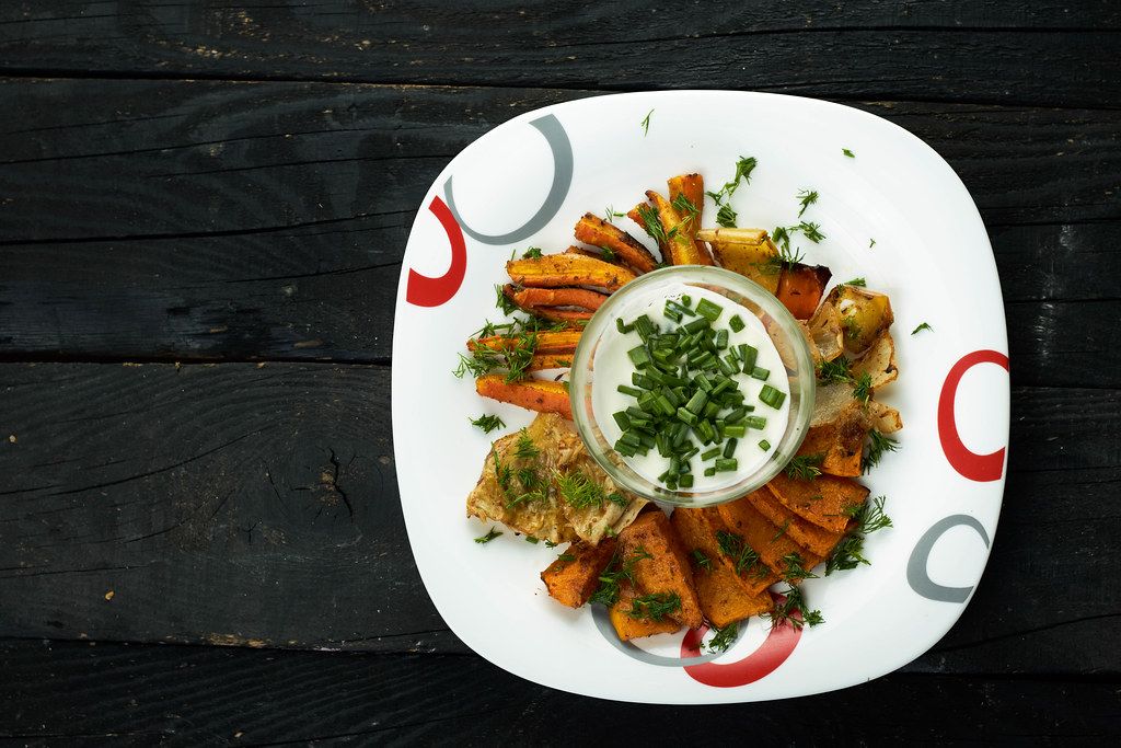 Freshly baked crunchy vegetable chips with delicious sour-cream based sauce