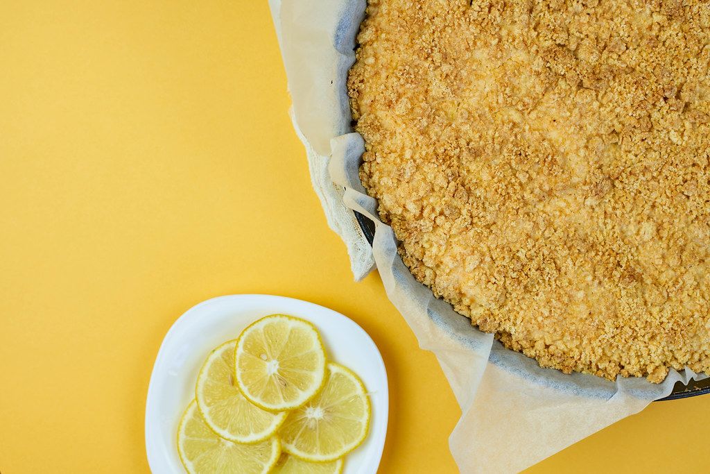Freshly cooked cottage cheese pie on yellow