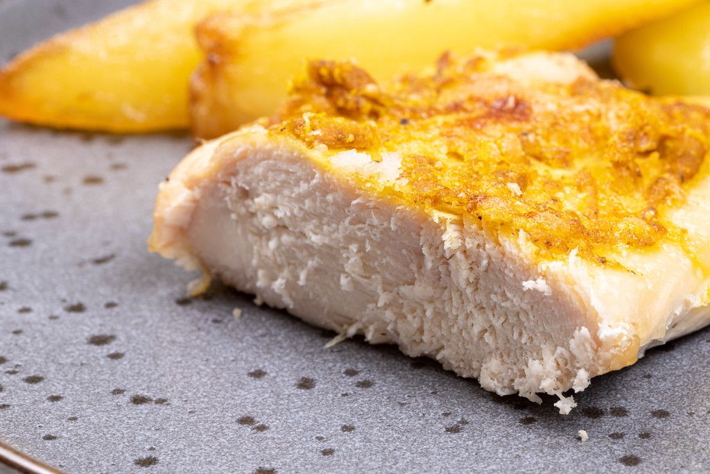 Fried Chicken Breasts with Cheese sliced on the plate