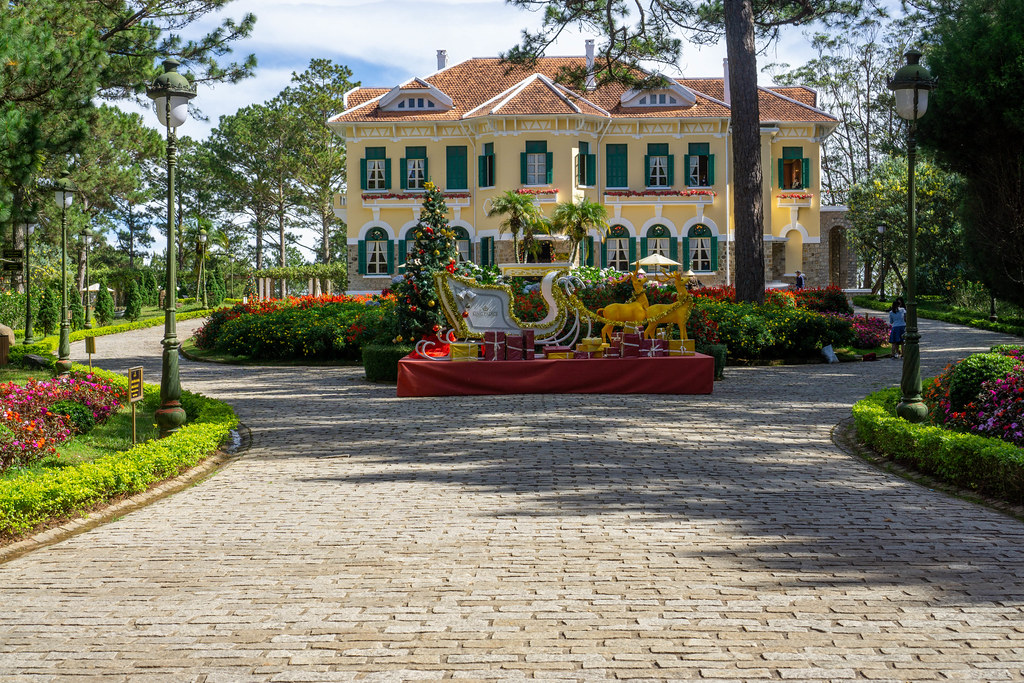 Front View of Bao Dai King Palace with Flower Garden and Christmas Decorations in Front in Da Lat, Vietnam