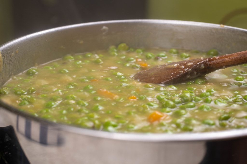 Frying pan with cooking Green Peas