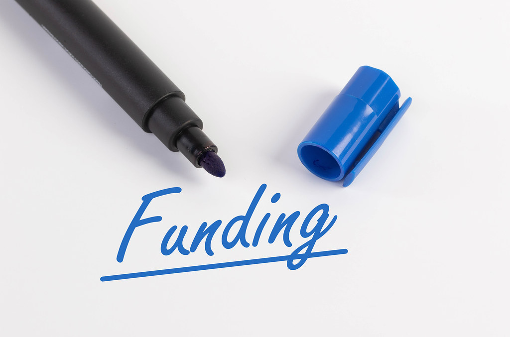 Funding text with blue marker pen
