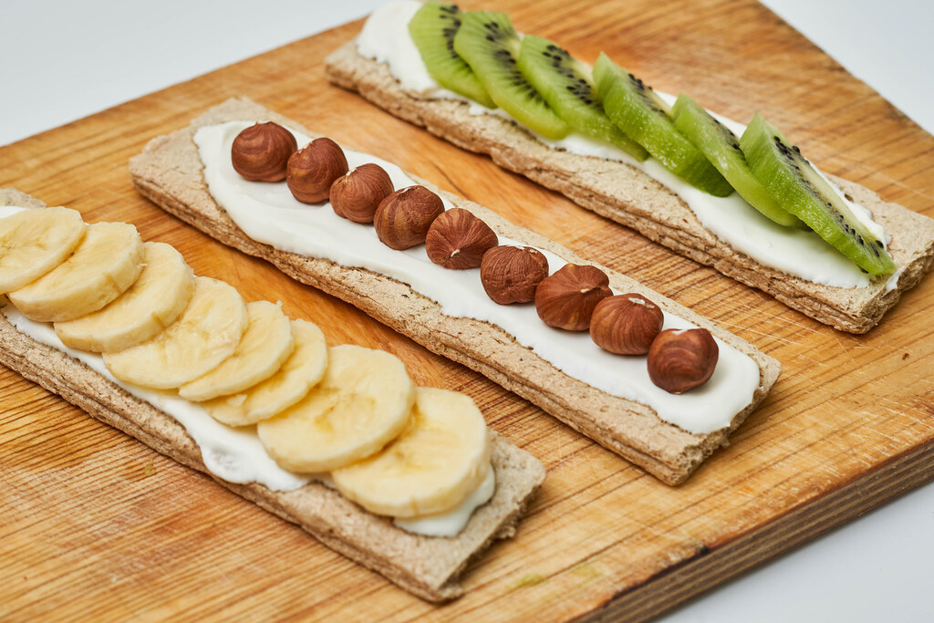 Garnished sandwiches with fresh fruits and nuts