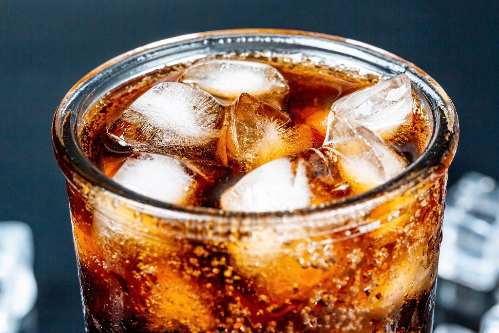 Glass of cola with ice, closeup