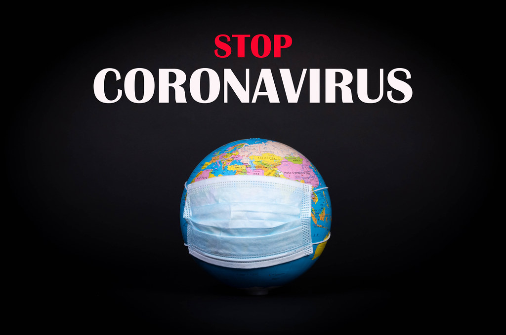 Globe with face mask and Stop Coronavirus text