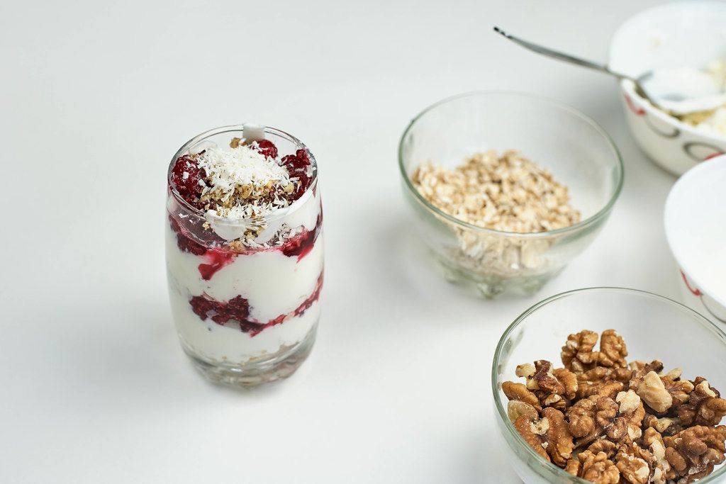 Gluten-free dessert with cottage cheese, oatmeal, raspberry jam and walnuts