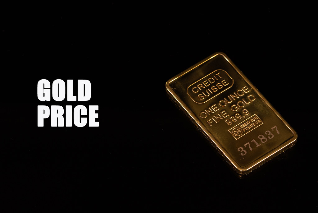 Gold bar with Gold price text on black background