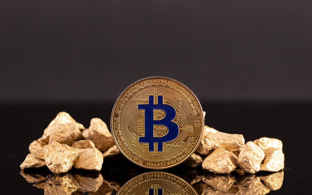 Golden Bitcoin and gold nuggets