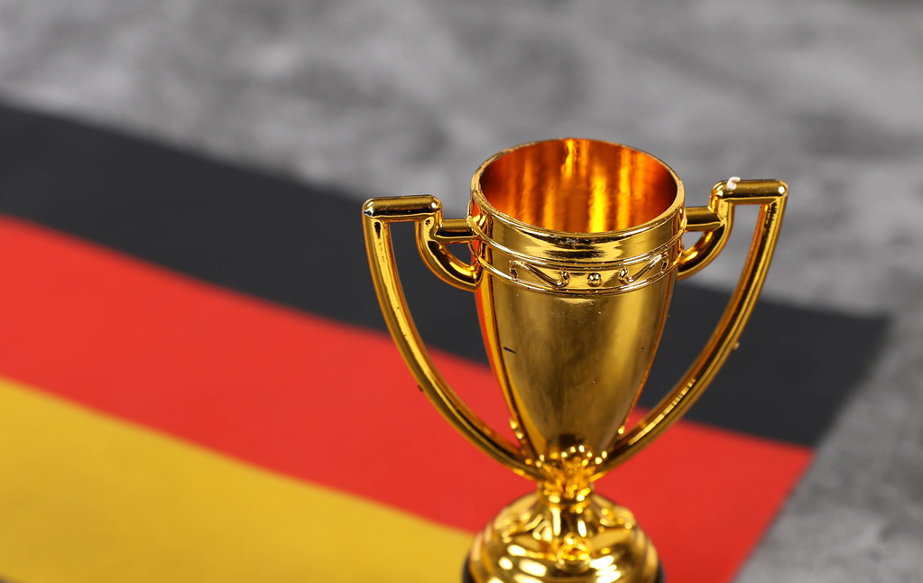 Golden trophy and flag of Germany