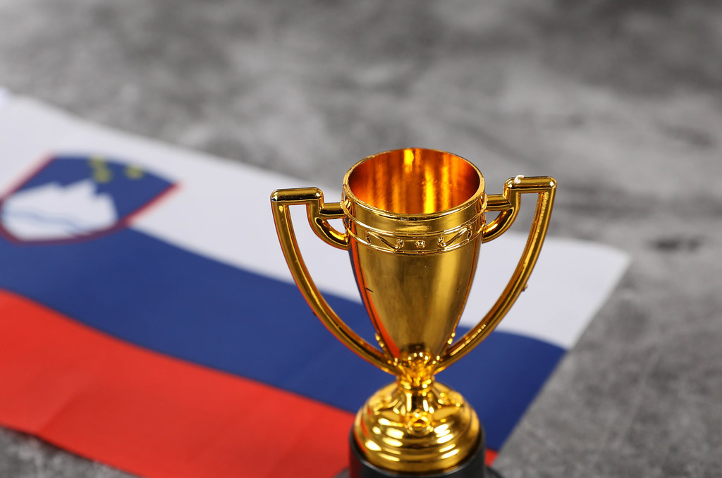 Golden trophy and flag of Slovenia