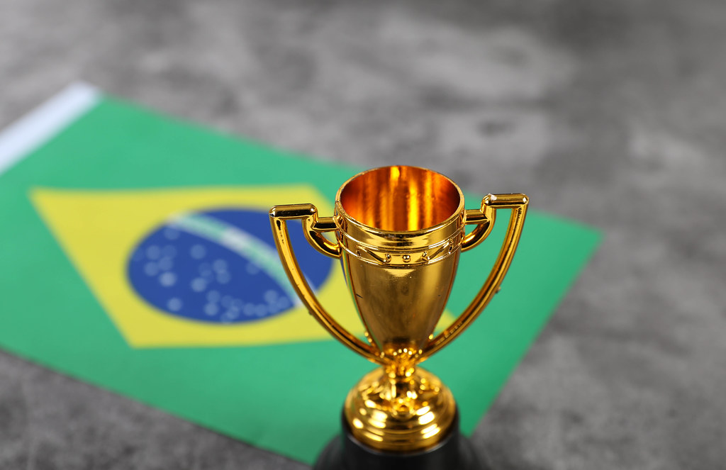 Golden trophy with flag of Brasil